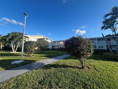 Immaculately maintained with newer updates! Move right into this on Hillsboro Pines Golf in Florida - for sale on GolfHomes.com, golf home, golf lot