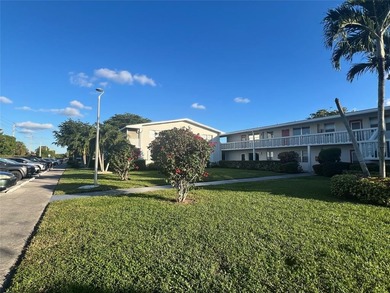 Immaculately maintained with newer updates! Move right into this on Hillsboro Pines Golf in Florida - for sale on GolfHomes.com, golf home, golf lot