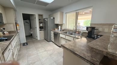 A move-in-ready home in Sun City West offers comfortable on Trail Ridge Golf Course in Arizona - for sale on GolfHomes.com, golf home, golf lot