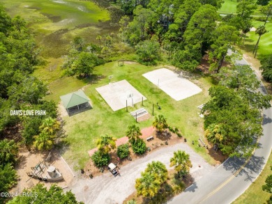 Discover the perfect coastal retreat at 123 Ocean Point Drive on Ocean Point Golf Links in South Carolina - for sale on GolfHomes.com, golf home, golf lot