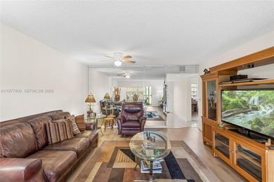 Enjoy spectacular lake and golf course views from this spacious on Flamingo Lakes Country Club in Florida - for sale on GolfHomes.com, golf home, golf lot