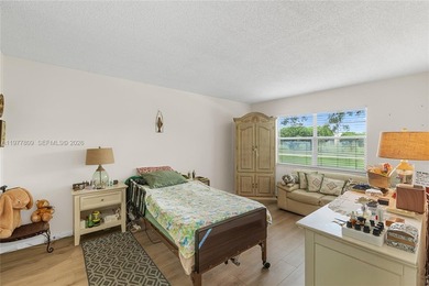 Enjoy spectacular lake and golf course views from this spacious on Flamingo Lakes Country Club in Florida - for sale on GolfHomes.com, golf home, golf lot
