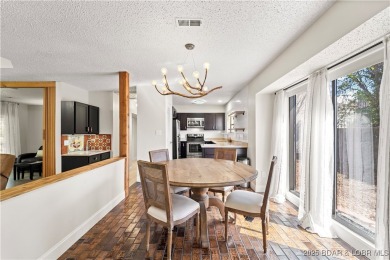 Welcome to this spacious yet cozy, 3 Bedroom, 2 Bath, end unit on Seasons Ridge At Four Seasons in Missouri - for sale on GolfHomes.com, golf home, golf lot