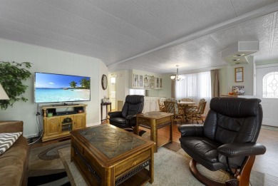 This furnished 2 bedroom, 2 bathroom home is situated on an on Maple Leaf Golf and Country Club in Florida - for sale on GolfHomes.com, golf home, golf lot