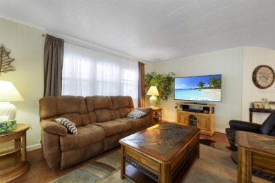 This furnished 2 bedroom, 2 bathroom home is situated on an on Maple Leaf Golf and Country Club in Florida - for sale on GolfHomes.com, golf home, golf lot