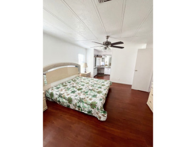Enjoy water views from this beautiful 2-bedroom, 2-bathroom home on Lake Fairways Country Club in Florida - for sale on GolfHomes.com, golf home, golf lot