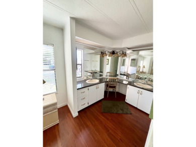 Enjoy water views from this beautiful 2-bedroom, 2-bathroom home on Lake Fairways Country Club in Florida - for sale on GolfHomes.com, golf home, golf lot