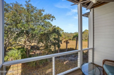 Enjoy coastal living with this charming 4-bedroom, 3-bathroom on Ocean Creek Golf Course in South Carolina - for sale on GolfHomes.com, golf home, golf lot