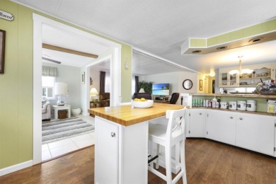 This furnished 2 bedroom, 2 bathroom home is situated on an on Maple Leaf Golf and Country Club in Florida - for sale on GolfHomes.com, golf home, golf lot
