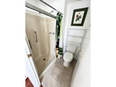 Enjoy water views from this beautiful 2-bedroom, 2-bathroom home on Lake Fairways Country Club in Florida - for sale on GolfHomes.com, golf home, golf lot