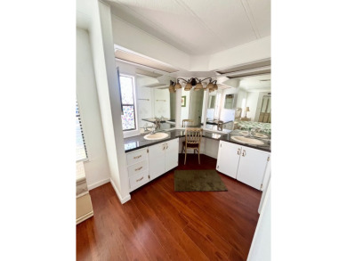 Enjoy water views from this beautiful 2-bedroom, 2-bathroom home on Lake Fairways Country Club in Florida - for sale on GolfHomes.com, golf home, golf lot