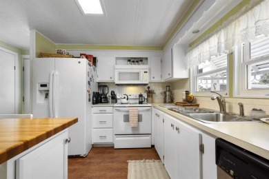 This furnished 2 bedroom, 2 bathroom home is situated on an on Maple Leaf Golf and Country Club in Florida - for sale on GolfHomes.com, golf home, golf lot