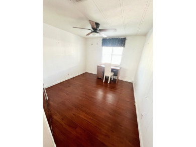Enjoy water views from this beautiful 2-bedroom, 2-bathroom home on Lake Fairways Country Club in Florida - for sale on GolfHomes.com, golf home, golf lot