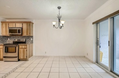 Discover this charming 2-bedroom, 2-bathroom villa in the on Cypress Lakes Golf Course - West Palm Beach in Florida - for sale on GolfHomes.com, golf home, golf lot