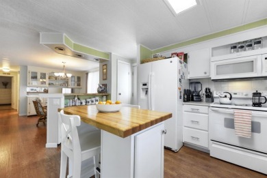 This furnished 2 bedroom, 2 bathroom home is situated on an on Maple Leaf Golf and Country Club in Florida - for sale on GolfHomes.com, golf home, golf lot