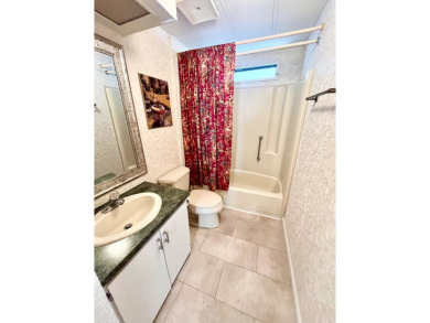 Enjoy water views from this beautiful 2-bedroom, 2-bathroom home on Lake Fairways Country Club in Florida - for sale on GolfHomes.com, golf home, golf lot