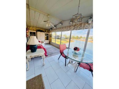 Enjoy water views from this beautiful 2-bedroom, 2-bathroom home on Lake Fairways Country Club in Florida - for sale on GolfHomes.com, golf home, golf lot