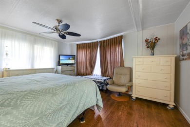 This furnished 2 bedroom, 2 bathroom home is situated on an on Maple Leaf Golf and Country Club in Florida - for sale on GolfHomes.com, golf home, golf lot