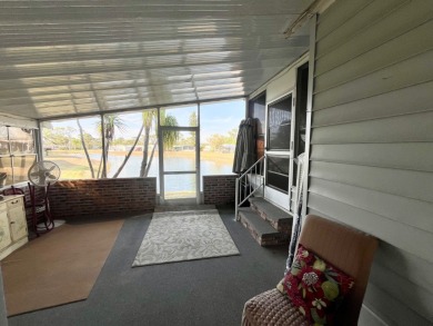 Enjoy water views from this beautiful 2-bedroom, 2-bathroom home on Lake Fairways Country Club in Florida - for sale on GolfHomes.com, golf home, golf lot