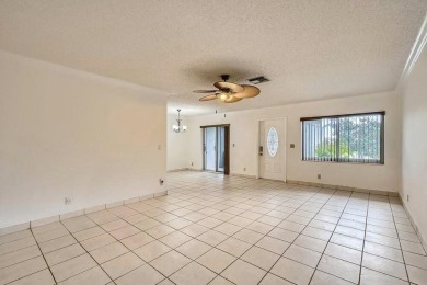 Discover this charming 2-bedroom, 2-bathroom villa in the on Cypress Lakes Golf Course - West Palm Beach in Florida - for sale on GolfHomes.com, golf home, golf lot