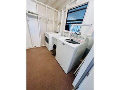 Enjoy water views from this beautiful 2-bedroom, 2-bathroom home on Lake Fairways Country Club in Florida - for sale on GolfHomes.com, golf home, golf lot