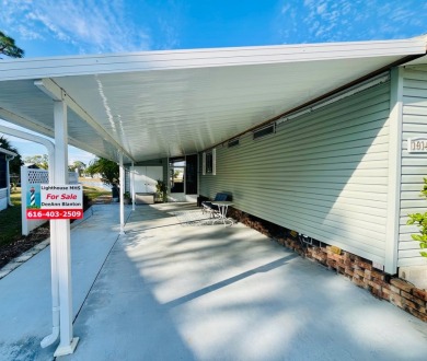 Enjoy water views from this beautiful 2-bedroom, 2-bathroom home on Lake Fairways Country Club in Florida - for sale on GolfHomes.com, golf home, golf lot