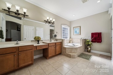 Nestled in the tranquil golf course landscape of Pine Island on Pine Island Country Club in North Carolina - for sale on GolfHomes.com, golf home, golf lot