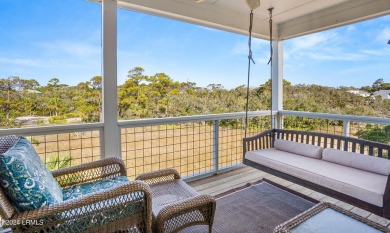 Enjoy coastal living with this charming 4-bedroom, 3-bathroom on Ocean Creek Golf Course in South Carolina - for sale on GolfHomes.com, golf home, golf lot