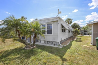 This furnished 2 bedroom, 2 bathroom home is situated on an on Maple Leaf Golf and Country Club in Florida - for sale on GolfHomes.com, golf home, golf lot