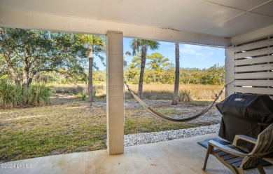 Enjoy coastal living with this charming 4-bedroom, 3-bathroom on Ocean Creek Golf Course in South Carolina - for sale on GolfHomes.com, golf home, golf lot