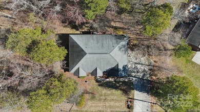 Nestled in the tranquil golf course landscape of Pine Island on Pine Island Country Club in North Carolina - for sale on GolfHomes.com, golf home, golf lot