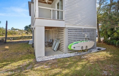 Enjoy coastal living with this charming 4-bedroom, 3-bathroom on Ocean Creek Golf Course in South Carolina - for sale on GolfHomes.com, golf home, golf lot