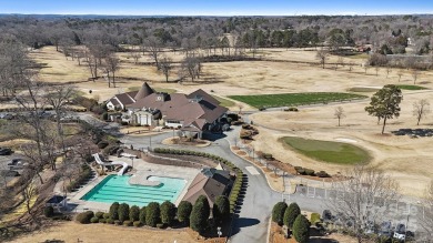 Nestled in the tranquil golf course landscape of Pine Island on Pine Island Country Club in North Carolina - for sale on GolfHomes.com, golf home, golf lot