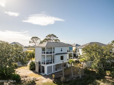 Enjoy coastal living with this charming 4-bedroom, 3-bathroom on Ocean Creek Golf Course in South Carolina - for sale on GolfHomes.com, golf home, golf lot