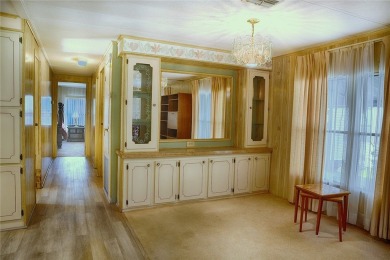 This home sits on a corner lot near our 18-hole golf course. It on Barefoot Bay Golf Course in Florida - for sale on GolfHomes.com, golf home, golf lot