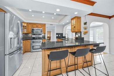 Welcome to an exceptional three-bedroom, two bath, one story on The Dunedin Country Club in Florida - for sale on GolfHomes.com, golf home, golf lot