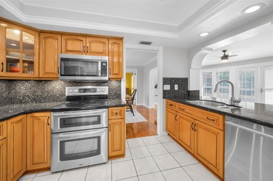 Welcome to an exceptional three-bedroom, two bath, one story on The Dunedin Country Club in Florida - for sale on GolfHomes.com, golf home, golf lot