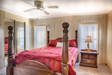 This home sits on a corner lot near our 18-hole golf course. It on Barefoot Bay Golf Course in Florida - for sale on GolfHomes.com, golf home, golf lot