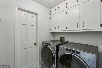 Tucked away on a large (over 1/2 acre lot) in the heart of on Indian Hills Country Club in Georgia - for sale on GolfHomes.com, golf home, golf lot