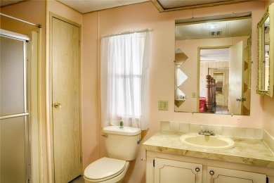 This home sits on a corner lot near our 18-hole golf course. It on Barefoot Bay Golf Course in Florida - for sale on GolfHomes.com, golf home, golf lot