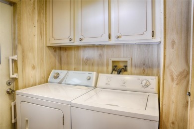 This home sits on a corner lot near our 18-hole golf course. It on Barefoot Bay Golf Course in Florida - for sale on GolfHomes.com, golf home, golf lot