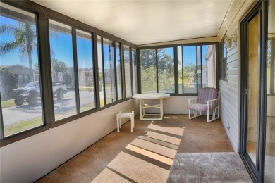This home sits on a corner lot near our 18-hole golf course. It on Barefoot Bay Golf Course in Florida - for sale on GolfHomes.com, golf home, golf lot