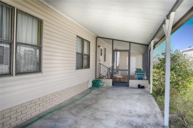 This home sits on a corner lot near our 18-hole golf course. It on Barefoot Bay Golf Course in Florida - for sale on GolfHomes.com, golf home, golf lot