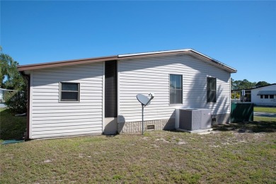This home sits on a corner lot near our 18-hole golf course. It on Barefoot Bay Golf Course in Florida - for sale on GolfHomes.com, golf home, golf lot
