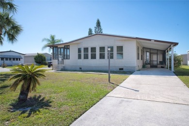 This home sits on a corner lot near our 18-hole golf course. It on Barefoot Bay Golf Course in Florida - for sale on GolfHomes.com, golf home, golf lot