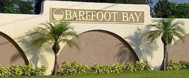 This home sits on a corner lot near our 18-hole golf course. It on Barefoot Bay Golf Course in Florida - for sale on GolfHomes.com, golf home, golf lot