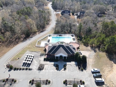 Nestled on a serene golf course, this spacious 0.66-acre lot on Oakview Golf and Country Club in Georgia - for sale on GolfHomes.com, golf home, golf lot