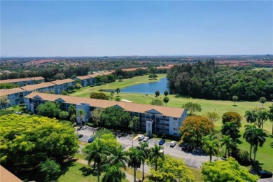 Enjoy beautiful golf course views from the large screened porch on Flamingo Lakes Country Club in Florida - for sale on GolfHomes.com, golf home, golf lot