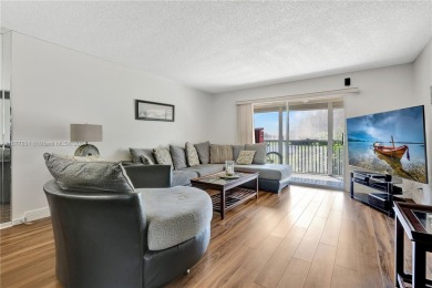 Enjoy beautiful golf course views from the large screened porch on Flamingo Lakes Country Club in Florida - for sale on GolfHomes.com, golf home, golf lot