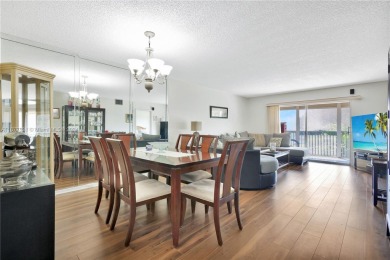 Enjoy beautiful golf course views from the large screened porch on Flamingo Lakes Country Club in Florida - for sale on GolfHomes.com, golf home, golf lot